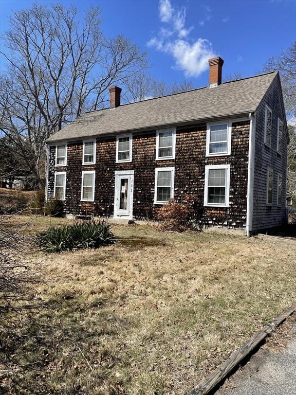 152 Acorn St, Marshfield, MA 02051 - colonial house featuring a chimney, roof with shingles, and a front yard