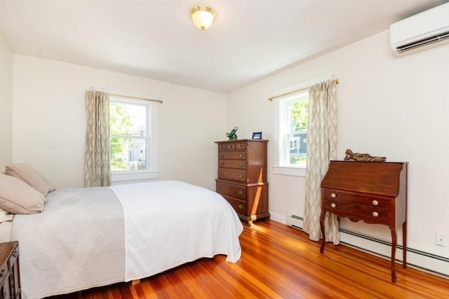 15 Dundee Rd, Quincy, MA 02171 - bedroom with a wall unit AC, multiple windows, and wood finished floors