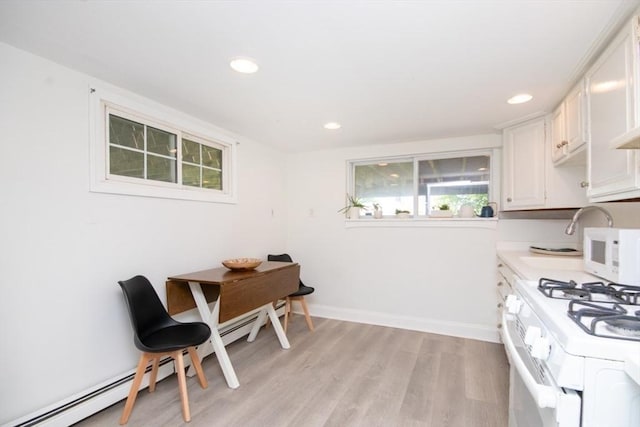 15 Dundee Rd, Quincy, MA 02171 - kitchen with white appliances, recessed lighting, light wood finished floors, baseboard heating, and light countertops