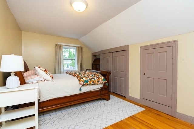 15 Dundee Rd, Quincy, MA 02171 - bedroom featuring light wood-style floors, vaulted ceiling, and baseboards
