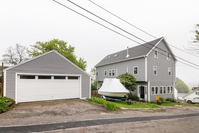 15 Dundee Rd, Quincy, MA 02171 - view of home's exterior with an outdoor structure and a detached garage