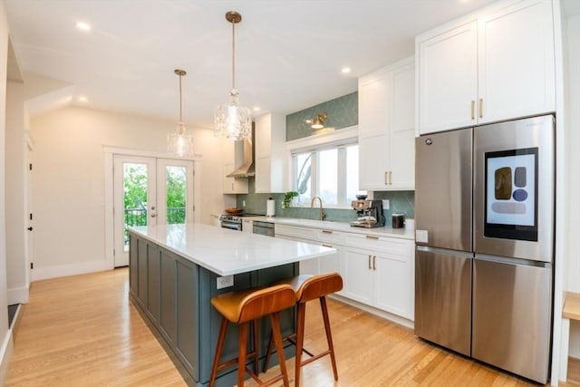 15 Dundee Rd, Quincy, MA 02171 - kitchen with stainless steel appliances, white cabinetry, plenty of natural light, and recessed lighting