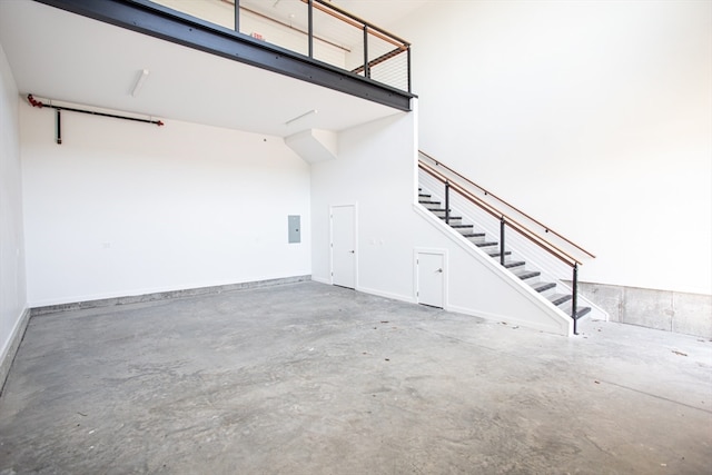 unfurnished living room with concrete flooring