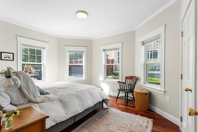 bedroom with crown molding and dark hardwood / wood-style floors