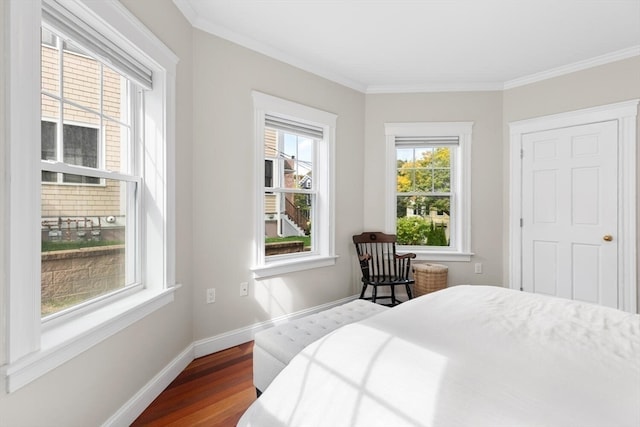 bedroom with crown molding and wood-type flooring