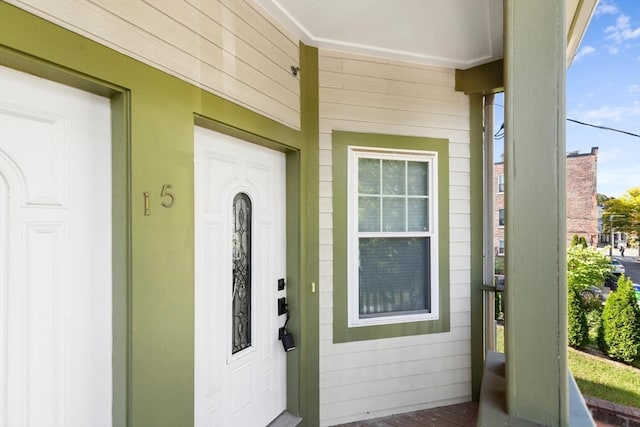 doorway to property with a porch