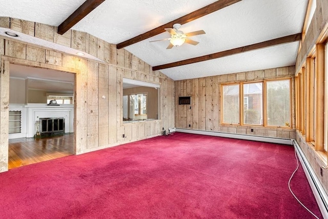 unfurnished living room featuring a textured ceiling, a baseboard heating unit, and lofted ceiling with beams