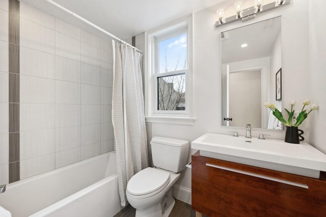 bathroom with vanity, toilet, and shower / bathtub combination with curtain