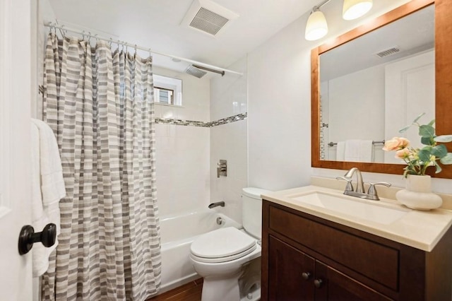 bathroom with toilet, shower / tub combo, visible vents, and vanity