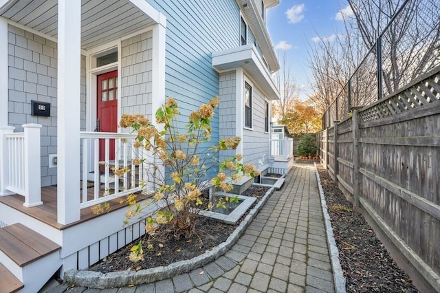 view of home's exterior with fence