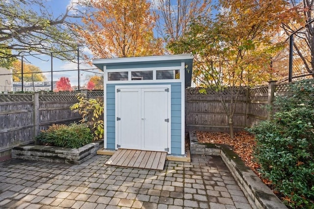 view of shed featuring a fenced backyard