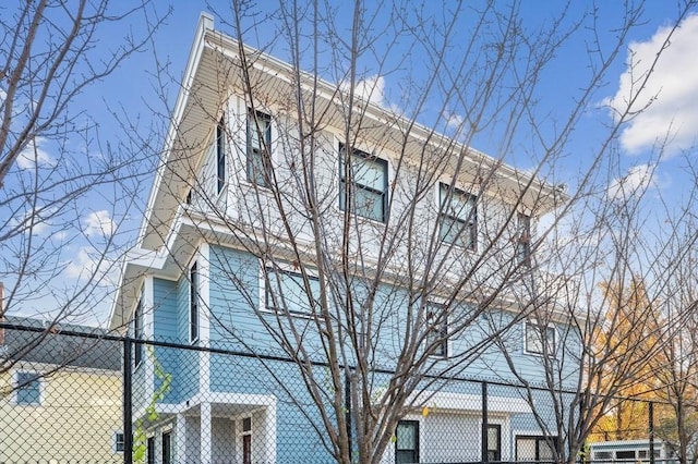 view of home's exterior with fence