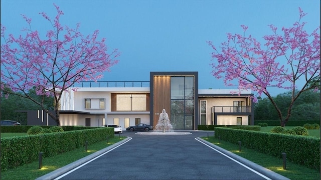 view of front of property with a balcony