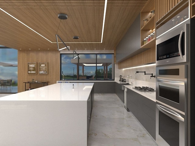 kitchen featuring light tile flooring, stainless steel appliances, tasteful backsplash, and wood ceiling