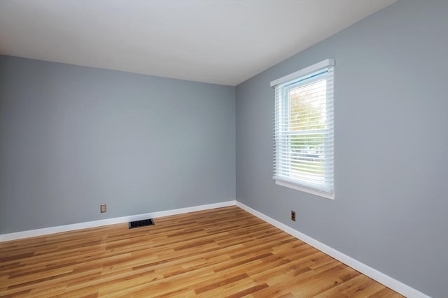 unfurnished room with visible vents, baseboards, and light wood-style flooring