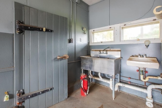 bathroom with concrete floors and a sink