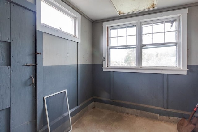 interior space featuring unfinished concrete flooring