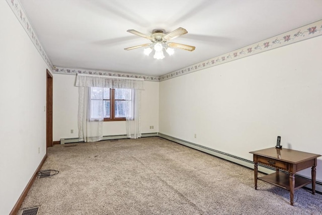 carpeted spare room with ceiling fan