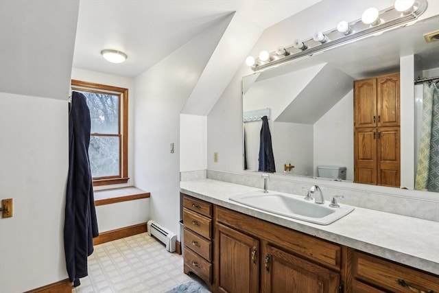 bathroom featuring vanity, a baseboard radiator, lofted ceiling, and toilet