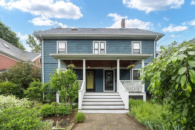34 Lewis Ave Unit 34, Arlington, MA 02474 - view of front facade featuring a chimney and covered porch