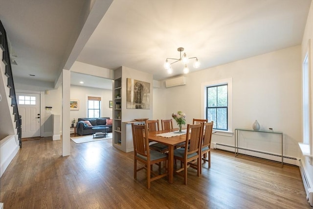 34 Lewis Ave Unit 34, Arlington, MA 02474 - dining space with an AC wall unit, a baseboard heating unit, healthy amount of natural light, and wood finished floors