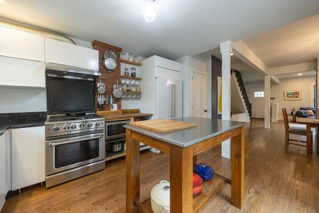 34 Lewis Ave Unit 34, Arlington, MA 02474 - kitchen with premium appliances, extractor fan, white cabinets, wood finished floors, and open shelves
