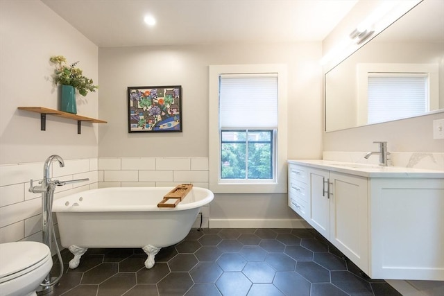 34 Lewis Ave Unit 34, Arlington, MA 02474 - bathroom with vanity, a freestanding tub, tile walls, tile patterned flooring, and recessed lighting