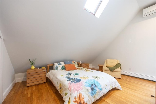 34 Lewis Ave Unit 34, Arlington, MA 02474 - bedroom featuring a wall mounted air conditioner, vaulted ceiling, wood finished floors, a baseboard radiator, and a skylight