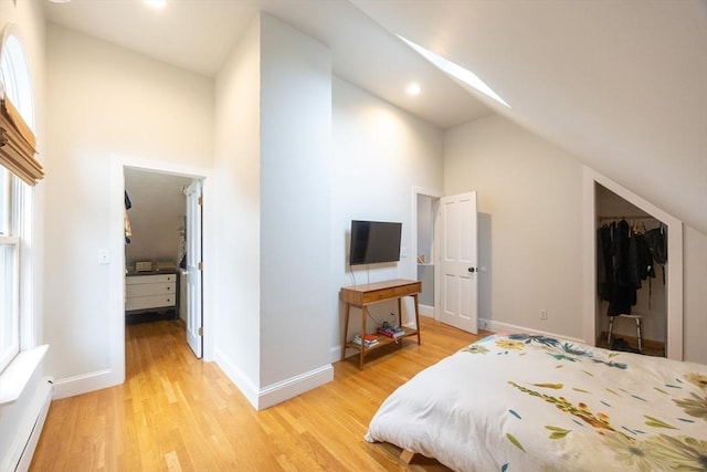 34 Lewis Ave Unit 34, Arlington, MA 02474 - bedroom with light wood-style floors, multiple windows, high vaulted ceiling, a closet, and recessed lighting
