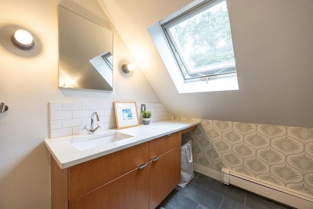 34 Lewis Ave Unit 34, Arlington, MA 02474 - bathroom featuring a skylight, baseboard heating, vanity, vaulted ceiling, and tile patterned flooring