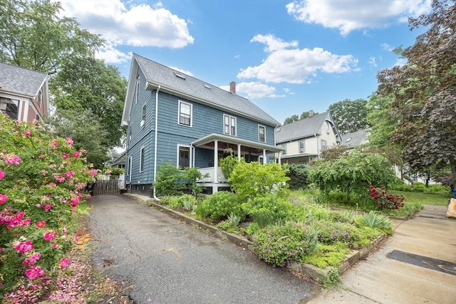 34 Lewis Ave Unit 34, Arlington, MA 02474 - view of front of house with a chimney, a porch, and driveway