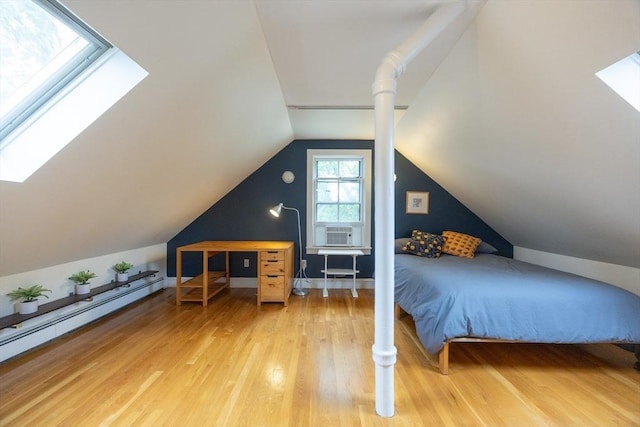 34 Lewis Ave Unit 34, Arlington, MA 02474 - bedroom featuring a skylight, wood finished floors, a baseboard heating unit, lofted ceiling, and cooling unit