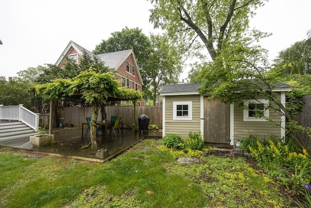 34 Lewis Ave Unit 34, Arlington, MA 02474 - fenced backyard with a deck and an outdoor structure