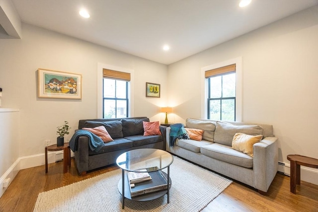 34 Lewis Ave Unit 34, Arlington, MA 02474 - living room featuring wood finished floors, recessed lighting, and a baseboard radiator