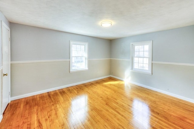 unfurnished room featuring light hardwood / wood-style floors