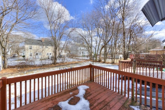 view of snow covered deck