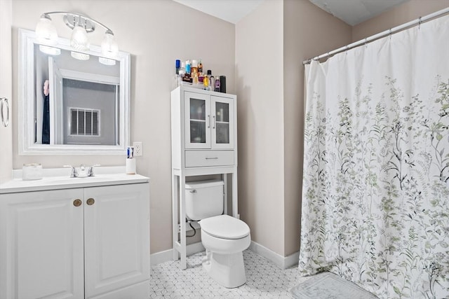 full bath featuring baseboards, toilet, vanity, a shower with shower curtain, and tile patterned floors