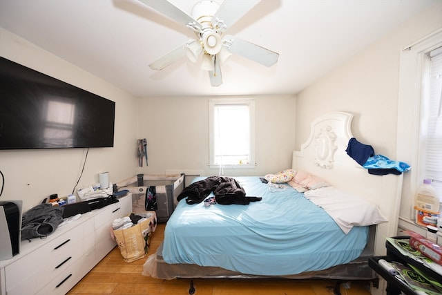 bedroom featuring ceiling fan and light wood-type flooring