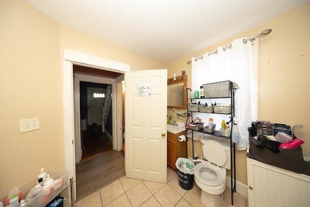 bathroom featuring sink, wood-type flooring, and toilet