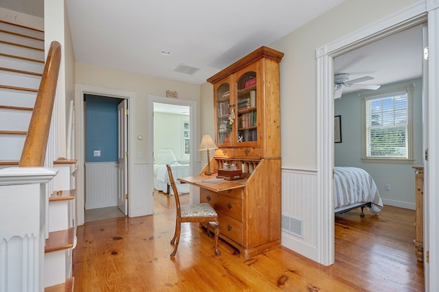 dining area with ceiling fan and light hardwood / wood-style flooring