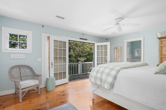 bedroom with ceiling fan, hardwood / wood-style flooring, and access to exterior