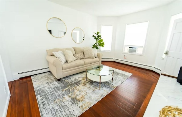 living room featuring baseboard heating, cooling unit, and hardwood / wood-style flooring