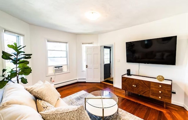 living room with hardwood / wood-style floors, cooling unit, and a baseboard heating unit