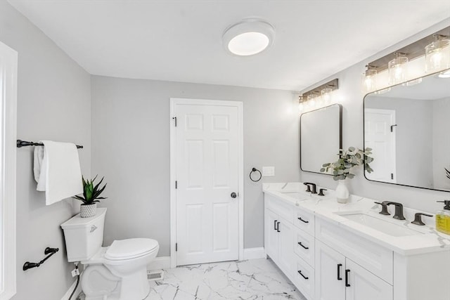 full bath with a sink, baseboards, toilet, and marble finish floor