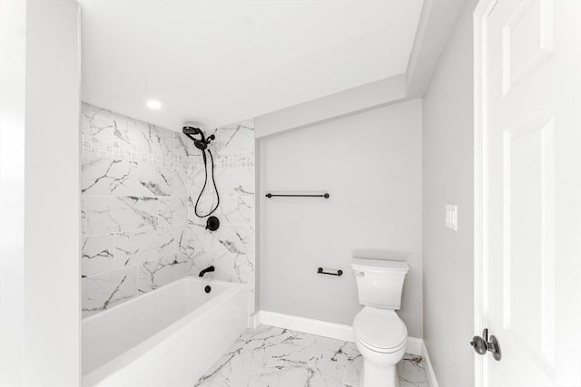 bathroom featuring marble finish floor, toilet, bathing tub / shower combination, and baseboards