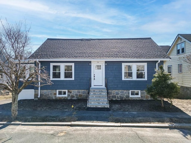 bungalow featuring a shingled roof