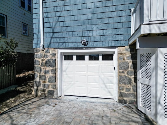 garage featuring decorative driveway