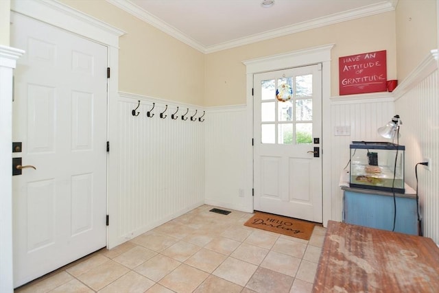 mudroom with a wainscoted wall, tile patterned flooring, ornamental molding, and visible vents