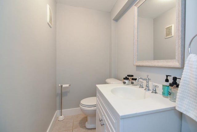 bathroom with vanity, visible vents, toilet, baseboards, and tile patterned floors