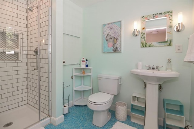 full bathroom featuring baseboards, tile patterned flooring, a stall shower, and toilet
